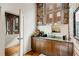 Charming powder room featuring modern sink, brick accent wall, and hardwood flooring at 500 Means Nw St # F, Atlanta, GA 30318
