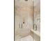 Luxurious tiled walk-in shower with rainfall showerhead and convenient built-in seat at 500 Means Nw St # F, Atlanta, GA 30318
