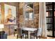 This dining room features a wooden table, seating for four and exposed brick walls at 500 Means Nw St # F, Atlanta, GA 30318