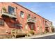 Vintage brick building features charming balconies and entryways, perfect for urban living or business at 500 Means Nw St # F, Atlanta, GA 30318