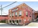 Exterior of a vintage brick factory with visible signage and potted trees at 500 Means Nw St # F, Atlanta, GA 30318