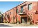 Brick building with small balconies, visible from the street, offers a unique blend of urban living and style at 500 Means Nw St # F, Atlanta, GA 30318