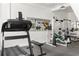 Home gym with state-of-the-art equipment, including a treadmill and multi-functional weight machine at 500 Means Nw St # F, Atlanta, GA 30318