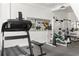 Home gym featuring treadmill, weight machines, and mirrored wall at 500 Means Nw St # F, Atlanta, GA 30318