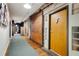 Apartment hallway with wood floors, exposed brick, and unique decor at 500 Means Nw St # F, Atlanta, GA 30318