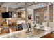 Open kitchen features custom cabinets, stainless steel appliances, granite countertops and exposed brick at 500 Means Nw St # F, Atlanta, GA 30318