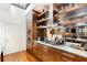 Modern kitchen boasts stainless steel appliances, custom cabinets, granite counters, and open shelving at 500 Means Nw St # F, Atlanta, GA 30318