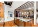 Open kitchen/living area features stainless steel appliances, granite counters and an exposed brick wall at 500 Means Nw St # F, Atlanta, GA 30318