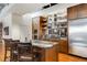 Contemporary kitchen features stainless appliances, custom cabinetry, granite counters, island and open shelving at 500 Means Nw St # F, Atlanta, GA 30318