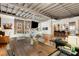 Open concept living space with exposed brick walls, hardwood floors and modern decor at 500 Means Nw St # F, Atlanta, GA 30318