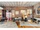 Open-concept living room with exposed brick walls, wood floors, and stylish decor and furniture at 500 Means Nw St # F, Atlanta, GA 30318
