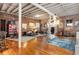 Spacious living room features exposed brick walls, wood floors, and a stunning chandelier at 500 Means Nw St # F, Atlanta, GA 30318