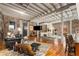 Spacious living room featuring exposed brick, beamed ceilings, and abundant natural light at 500 Means Nw St # F, Atlanta, GA 30318