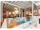 Expansive living room with exposed brick and beams, featuring a chandelier and open floor plan at 500 Means Nw St # F, Atlanta, GA 30318