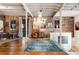 Bright living room features exposed brick, hardwood flooring, and a modern staircase at 500 Means Nw St # F, Atlanta, GA 30318