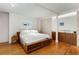 Spacious primary bedroom features hardwood floors, platform bed, and convenient access to the bathroom at 500 Means Nw St # F, Atlanta, GA 30318