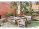Cozy outdoor patio space with wood table, seating, and surrounding greenery at 500 Means Nw St # F, Atlanta, GA 30318