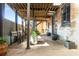 Outdoor patio with overhead cover providing a semi-covered area for tables at 500 Means Nw St # F, Atlanta, GA 30318