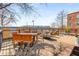 Spacious rooftop deck with city views, featuring outdoor furniture, greenery, and industrial surroundings at 500 Means Nw St # F, Atlanta, GA 30318