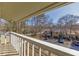 Balcony view overlooking a landscaped residential neighborhood, showcasing serene outdoor living and architecture at 702 Hanover Se Ln, Marietta, GA 30067