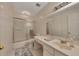 Bathroom with a shower-tub combo, a neutral sink vanity with a large mirror, and a gray and white color scheme at 702 Hanover Se Ln, Marietta, GA 30067