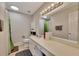 Bathroom featuring a tub/shower, a white sink vanity with a large mirror, light fixtures, and neutral decor at 702 Hanover Se Ln, Marietta, GA 30067