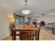 Inviting dining area featuring a wood table and a fireplace in an open-concept design, with natural light and neutral colors at 702 Hanover Se Ln, Marietta, GA 30067