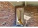 Entryway shows brick facade and open doorway leading into a bright interior with wood floors at 702 Hanover Se Ln, Marietta, GA 30067