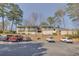 Multi-Gathering exterior with balconies and ample parking in a wooded setting at 702 Hanover Se Ln, Marietta, GA 30067