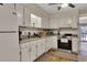 Functional kitchen with ample cabinet space and essential appliances included at 702 Hanover Se Ln, Marietta, GA 30067