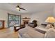 Comfortable living room featuring a fireplace and sliding door access to the patio at 702 Hanover Se Ln, Marietta, GA 30067