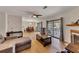 Open floor plan shows the living room, dining area, and balcony access at 702 Hanover Se Ln, Marietta, GA 30067