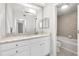 Bright bathroom features a tiled shower and double vanity at 1445 Monroe Ne Dr # G7, Atlanta, GA 30324