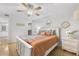 Bright bedroom with ceiling fan, hardwood floors, and ample natural light at 1445 Monroe Ne Dr # G7, Atlanta, GA 30324