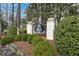 Elegant entrance to Carlyle Heights Condominiums, with manicured landscaping and stone pillars at the gated entrance at 1445 Monroe Ne Dr # G7, Atlanta, GA 30324