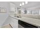 Kitchen with granite countertop, modern faucet, and access to the dining area at 1445 Monroe Ne Dr # G7, Atlanta, GA 30324