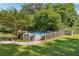 Fenced community pool area, surrounded by lush greenery, offering a safe and enjoyable outdoor amenity at 1445 Monroe Ne Dr # G7, Atlanta, GA 30324