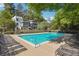 Community pool with lounge chairs, offering a relaxing outdoor experience with well-maintained landscaping at 1445 Monroe Ne Dr # G7, Atlanta, GA 30324