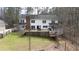 Beautiful two-story home with a large deck and an expansive backyard at 1700 Bailey Creek Sw Rd, Conyers, GA 30094