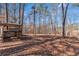 Backyard area features custom outdoor play structure and lots of shade at 1700 Bailey Creek Sw Rd, Conyers, GA 30094