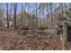 Backyard pond with wood deck and an umbrella at 1700 Bailey Creek Sw Rd, Conyers, GA 30094