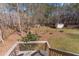 Spacious fenced-in backyard featuring a fire pit, a storage shed, and plenty of room for recreation at 1700 Bailey Creek Sw Rd, Conyers, GA 30094