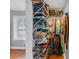 Organized walk-in closet with shelves and hanging storage at 1700 Bailey Creek Sw Rd, Conyers, GA 30094