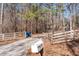 Driveway near fence with mailbox and trash bins at 1700 Bailey Creek Sw Rd, Conyers, GA 30094