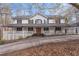 Charming two-story home featuring a welcoming front porch with a double door entrance at 1700 Bailey Creek Sw Rd, Conyers, GA 30094