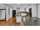 Bright open kitchen with a center island, black appliances, and an adjacent dining space at 1700 Bailey Creek Sw Rd, Conyers, GA 30094