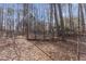 Picture of a property with extensive fencing and wooded landscape at 1700 Bailey Creek Sw Rd, Conyers, GA 30094