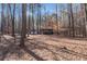 Multiple outbuildings nestled among the trees, offering flexible space at 1700 Bailey Creek Sw Rd, Conyers, GA 30094