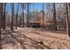 Several convenient outbuildings in the backyard, adding value to the wooded property at 1700 Bailey Creek Sw Rd, Conyers, GA 30094