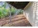 Exterior shot of the house, showing the structural supports for the backyard deck above at 994 Chapman Cir, Stone Mountain, GA 30088